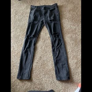 Black jeans with manufacturers holes